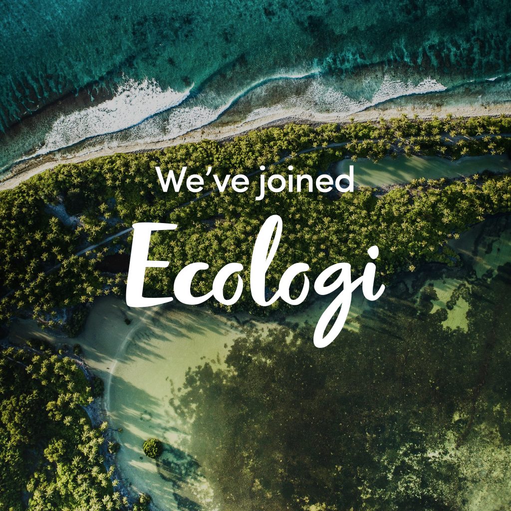 A birds eye view of a tropical coast line with the words "we've joined Ecologi" over the top.